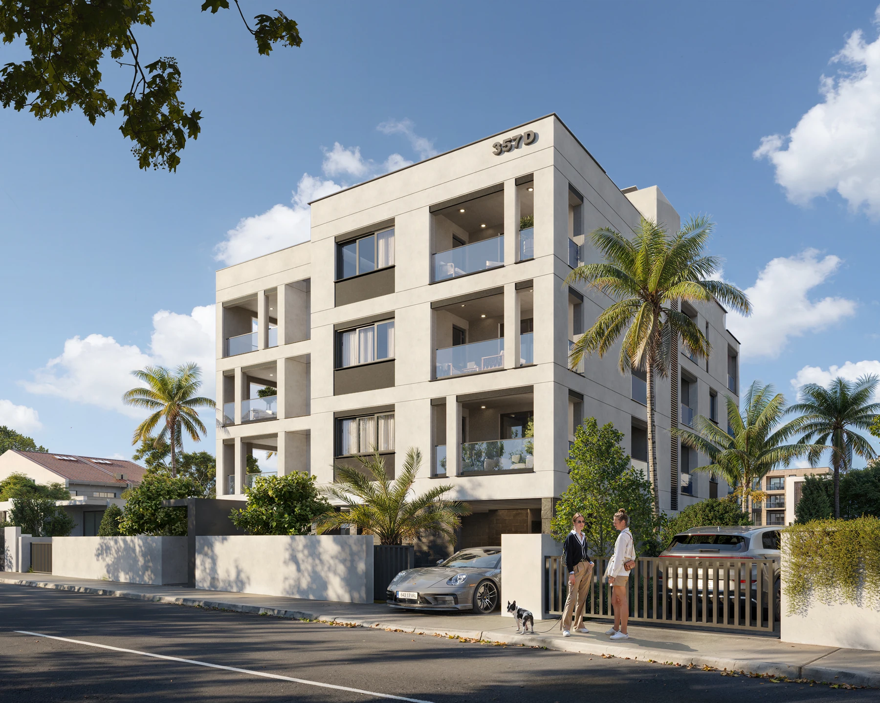 Contemporary apartment building with balconies, palm trees and a gated entrance.