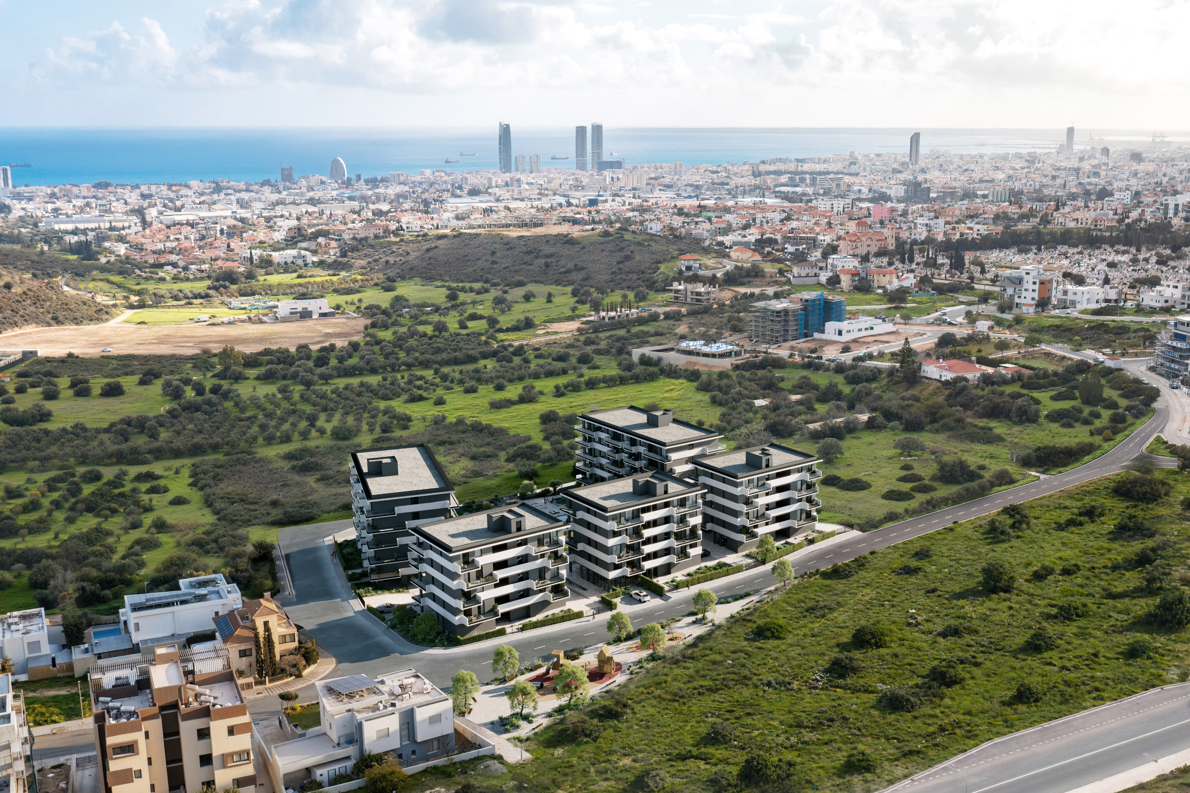 Aerial view of QUARTER FIVE in Germasogeia, with Limassol and the Mediterranean Sea in the distance