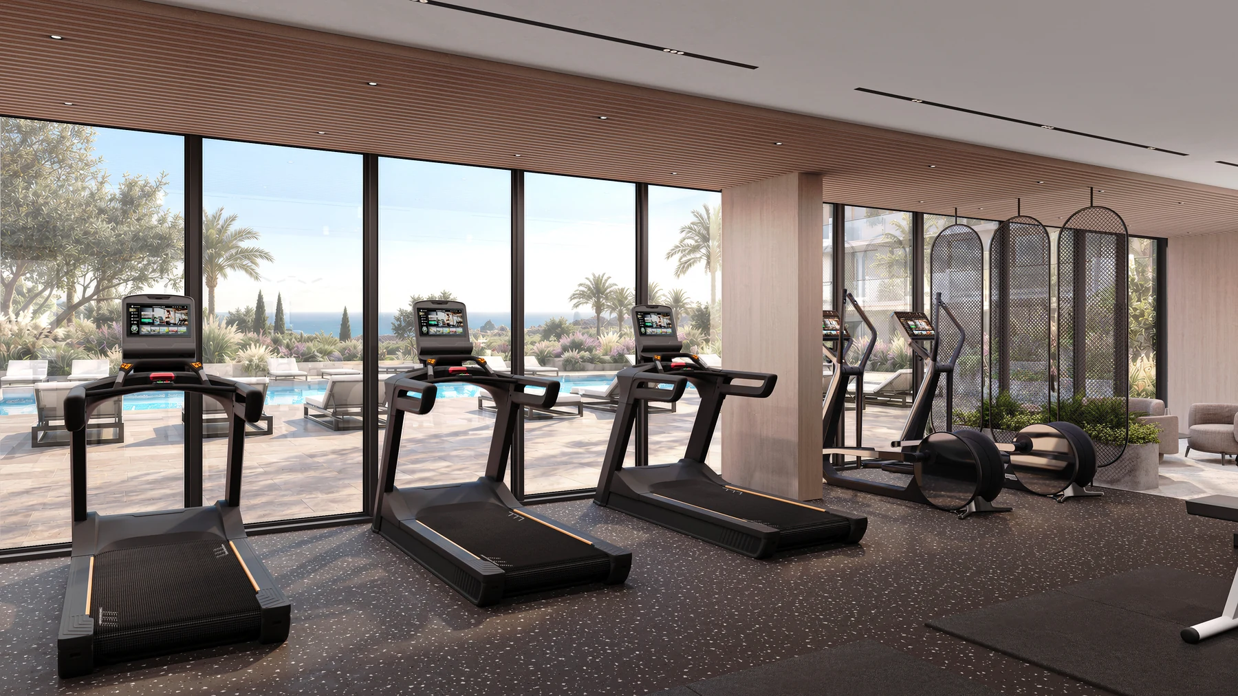 Treadmills and cardio equipment beside full-height windows overlooking the gardens.